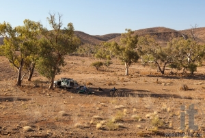 People are resting in shade of a tree on a very hot day. Flinders Ranges. South Australia.