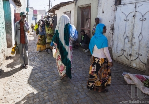HARAR, ETHIOPIA - DECEMBER 23, 2013: Unidentified people of ancient walled city of Jugol in their daily routine activities that almost unchanged in more than four hundred years.
