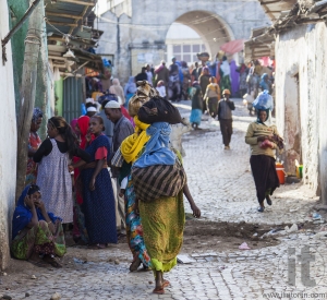 HARAR, ETHIOPIA - DECEMBER 23, 2013: Unidentified people of ancient walled city of Jugol in their daily routine activities that almost unchanged in more than four hundred years.