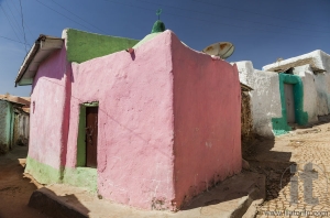 Pink house in narrow alleyway of ancient city of Jugol in the mo