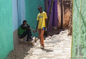Two young men posing in typical surroundings in ancient walled city of Jugol, that daily life is almost unchanged in more than four hundred years. Harar. Ethiopia.
