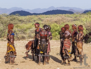 Group of Hamar women dance during bull jumping ceremony.