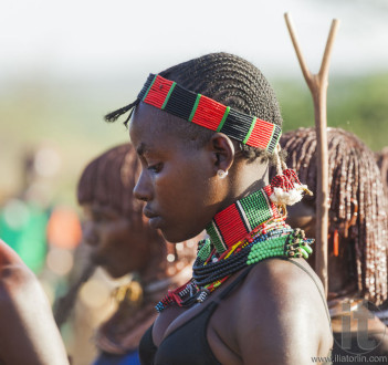 Portrait of young Hamar woman at bull jumping ceremony.