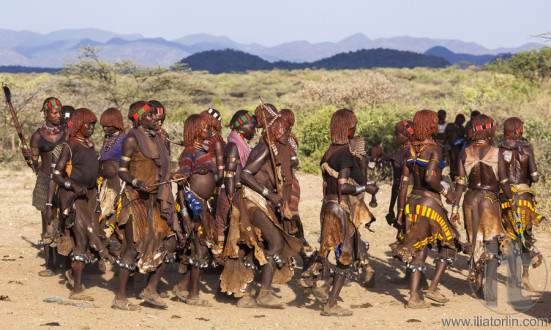 Group of Hamar women dance during bull jumping ceremony.