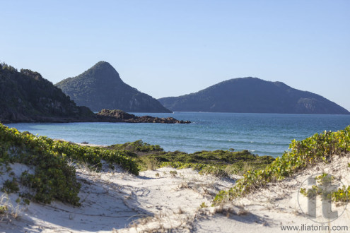 Landscape with sand dunes ocean islands and hills. Fingal Bay. Port Stephens. Australia.