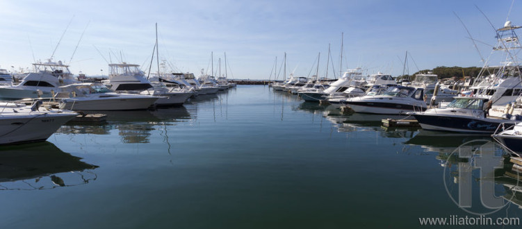 Yachts and motor boats at harbor moored at marina. Port Stephens. Nelson Bay. Australia.