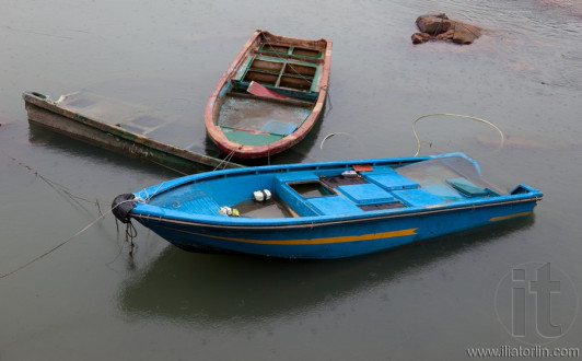 Half submerged small boats. Cheung Chau. Hong Kong.