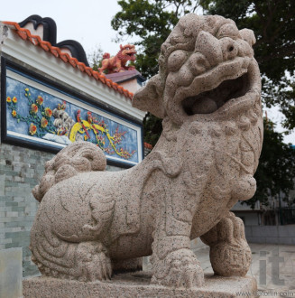 Lion in front of the entrance to Pak Tai Temple. Cheung Chau. Hong Kong.