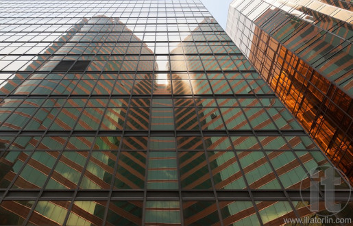 Reflection of a skyscraper on a skyscraper. Kowloon. Hong Kong.