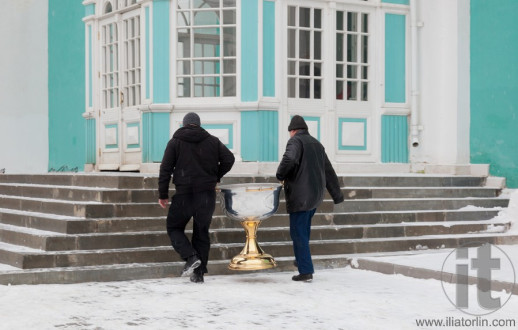 Two men carrying baptistery. Assumption (Uspenski) cathedral. Smolenk. Russia
