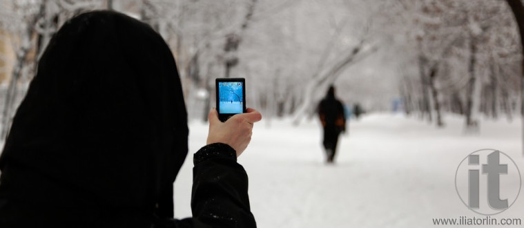Woman taking picture with digital camera. Moscow. Russia.