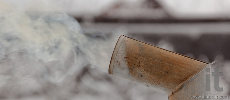 Smoke from samovarâs chimney in winter. Moscow region. Russia.