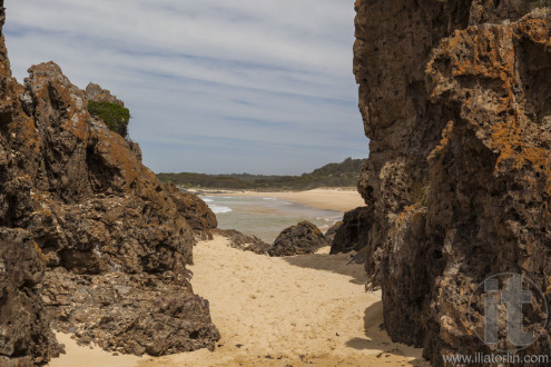 Rocks and beach at Mullimbura point near Bingi. Nsw. Australia.