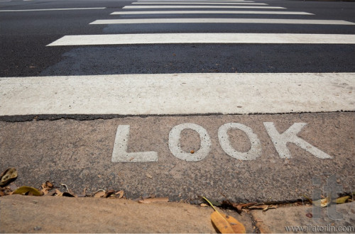 Pedestrian crossing (zebra) with word 'look' in front of it.