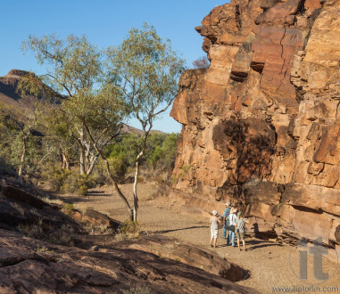 Tourists at Chambers Gorge aboriginal engraving site. Flinders Ranges. South Australia