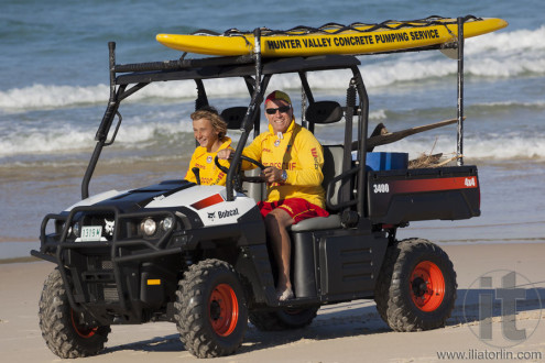 Two beach lifesavers in a surf patrol cart. Fingal Bay. Port Stephens. Australia.