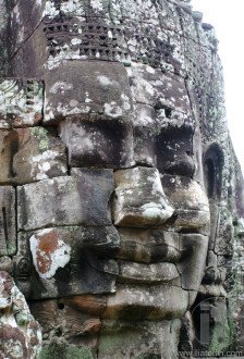 Close-up of smiling face of the king Jayavarman VII in the temple of Bayon, Angkor Wat, Siem Riep, Cambodia.