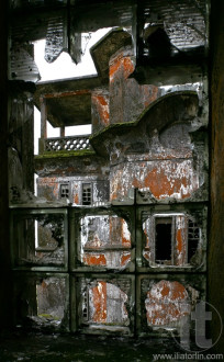 Destroyed by the war glass block window in the abandoned 5 star hotel 'Bokor Palace' in Ghost town Bokor Hill station near the town of Kampot. Cambodia.