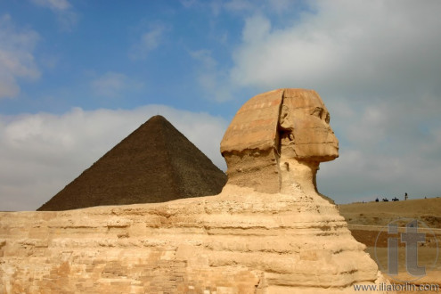 Giza sphinx with pyramids on the background. Egypt.