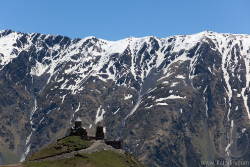 Gergeti Trinity Church and Caucasus Mountains. Stepantsminda. Georgia.