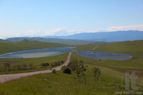 Meadows, country road and two lakes near David Gareja monastery. Kakheti. Georgia.
