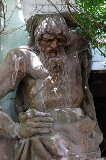 Unrestored atlas on a facade. Tbilisi. Georgia.