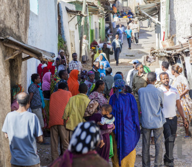 HARAR, ETHIOPIA - DECEMBER 23, 2013: Unidentified people of ancient walled city of Jugol in their daily routine activities that almost unchanged in more than four hundred years.