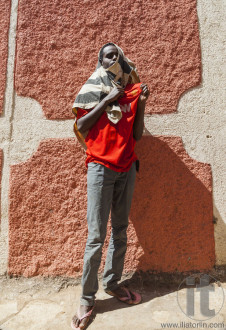 HARAR, ETHIOPIA - DECEMBER 24, 2013: Unidentified young man posi