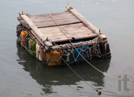 Personal pontoon ferry made from empty plastic containers. Cheung Chau. Hong Kong.