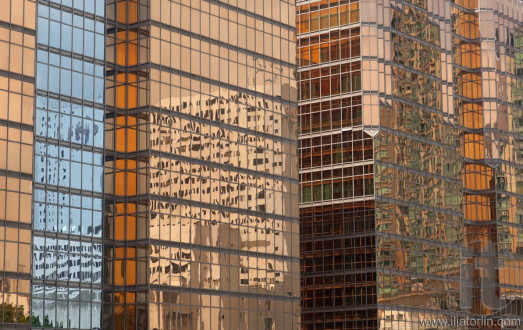 Reflection of a skyscraper on a skyscraper. Kowloon. Hong Kong.