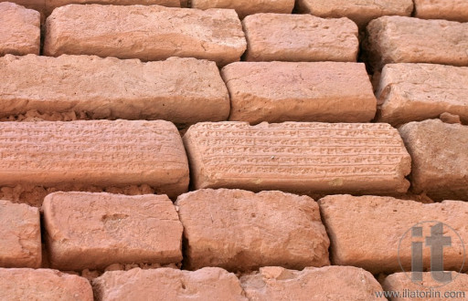Brick wall with cuneiform writing on bricks in Shoqa Zanbil near Shush, Iran