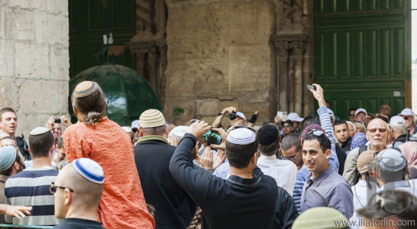 People celebrate near exit from Temple Mount. Jerusalem, Israel.