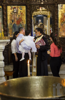 Child baptism in Basilica of the Annunciation. Nazareth. Israel.