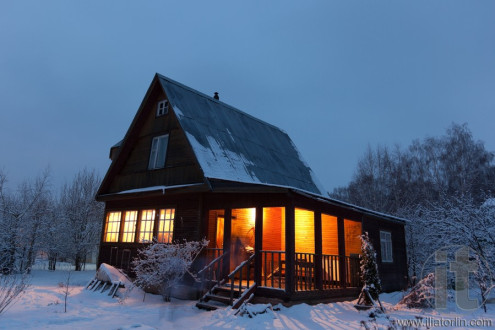 Country house (dacha) in winter dawn. Moscow region. Russia.