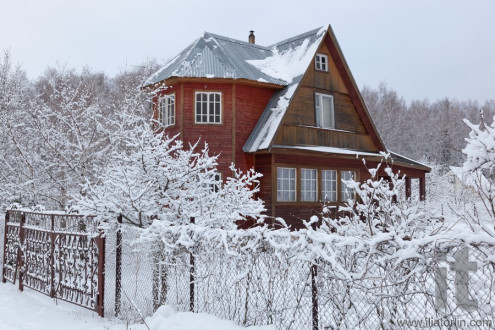 House in countryside after heavy snowfall. Moscow region. Russia.