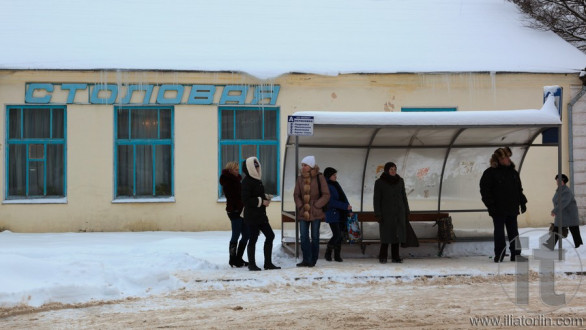 People waiting for a bus on a bus stop. Gagarin (former Gzhatsk). Russia.