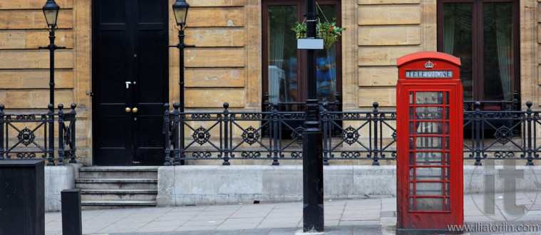 Red phone booths in central London. UK.