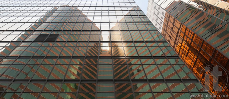 Reflection of a skyscraper on a skyscraper. Kowloon. Hong Kong.