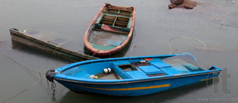 Half submerged small boats. Cheung Chau. Hong Kong.